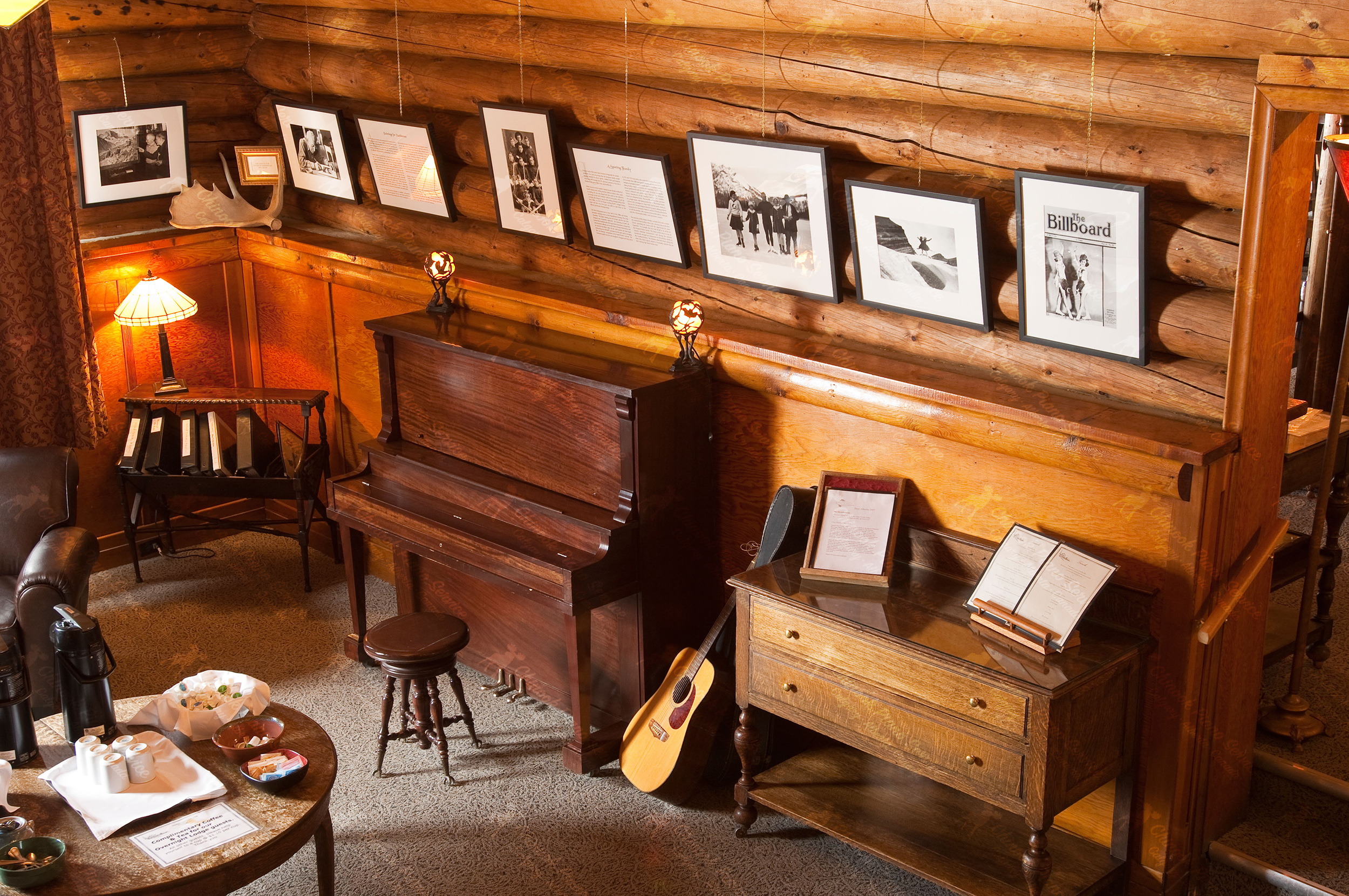 Upright piano inside a log cabin